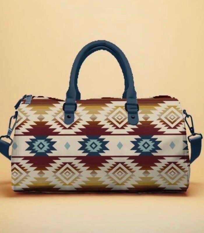 Large Southwest printed duffle travel bag in Dakota Beige WITH Geometric pattern in blue, red, and gold. Features shoulder straps and durable woven fabric. Approximate size 30*18*12 inches