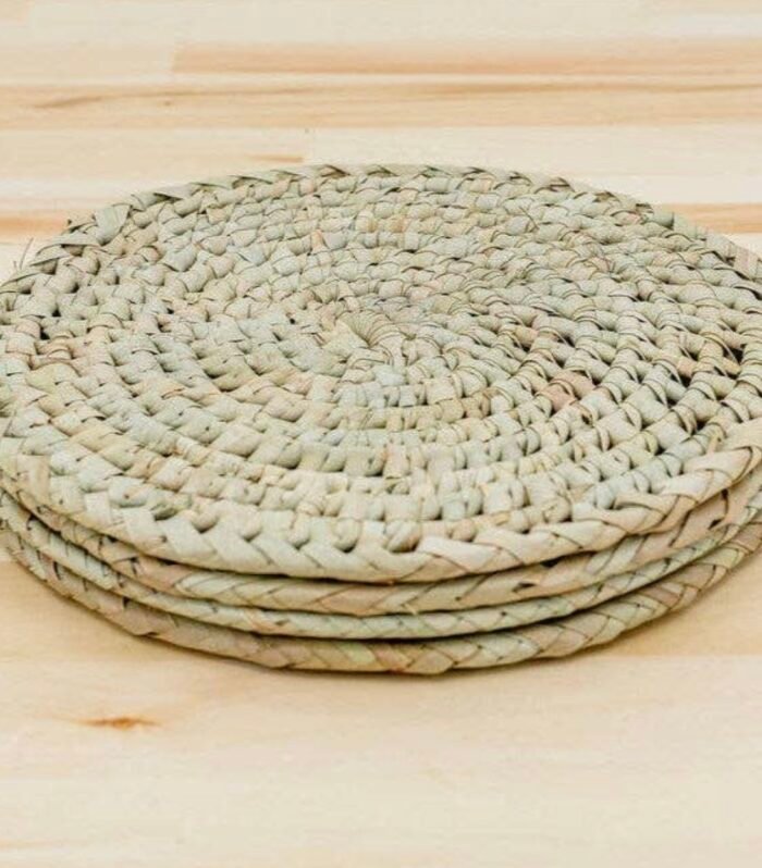 Set of four round handwoven palm leaf placemats handmade in Kenya.13 diameter